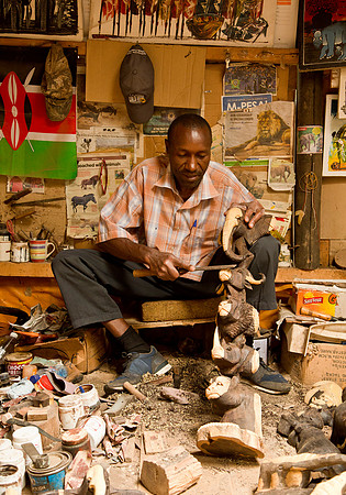 Sculptor Carving Ebony Figures